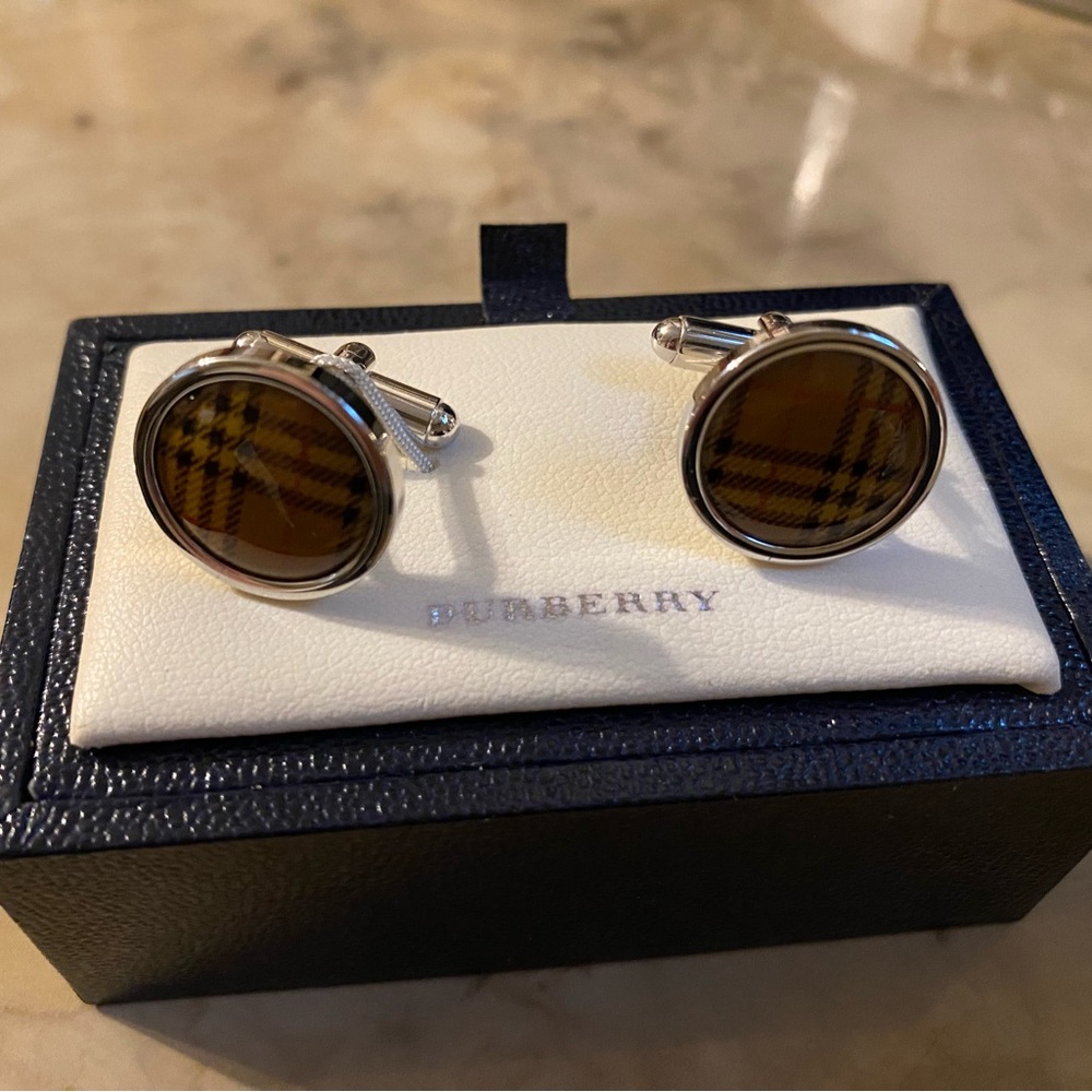 Brand new traditional pattern Burberry cuff links. Great condition.